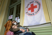 -  Yulia* and her son Danilo* 10, sit in Przemysl train station in Poland, on 3 March 2022