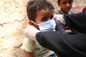 Child wearing a mask in Yemen