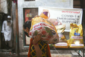 Women from ActionAid’s Young Urban Women Programme in Dharavi receive food kits as part of Covid relief distribution.